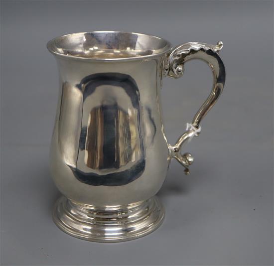 A George III silver baluster mug, with engraved initials, maker I.B, London, 1771, 12.8cm, 11.5 oz.